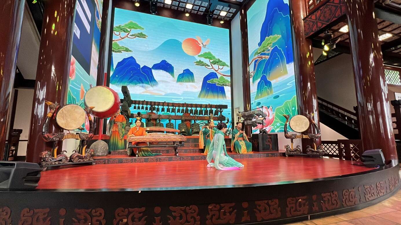 A group of people on a stage
Description automatically generated