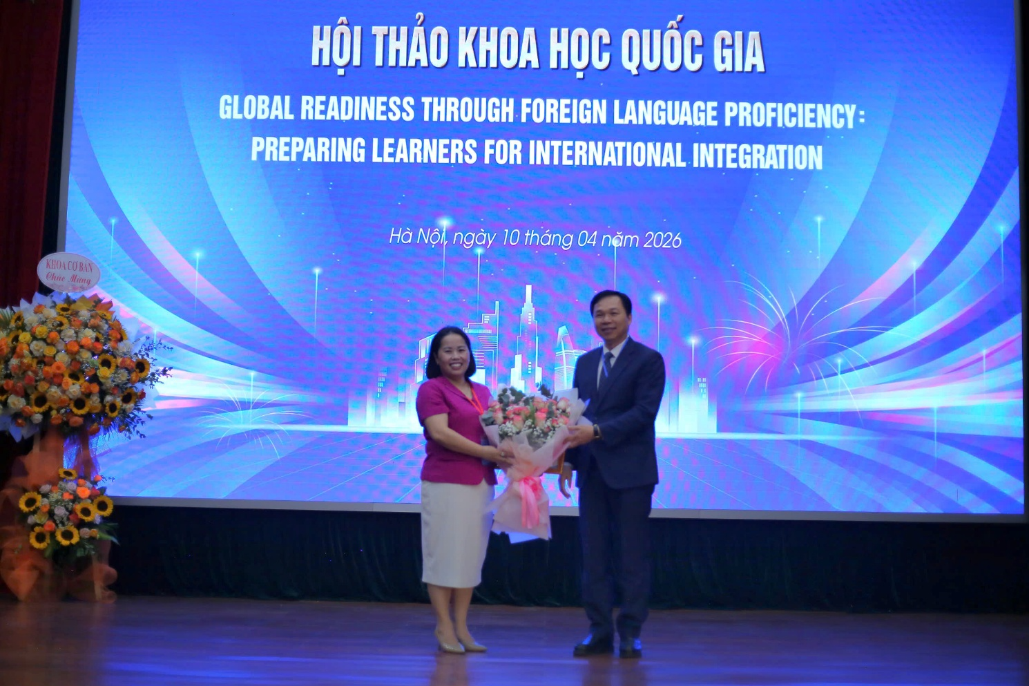 A person and person holding flowers Description automatically generated