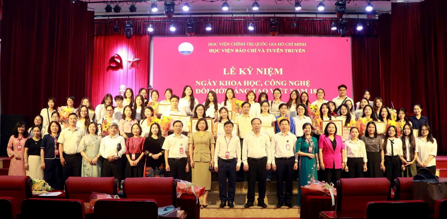 A group of people standing on a stage Description automatically generated
