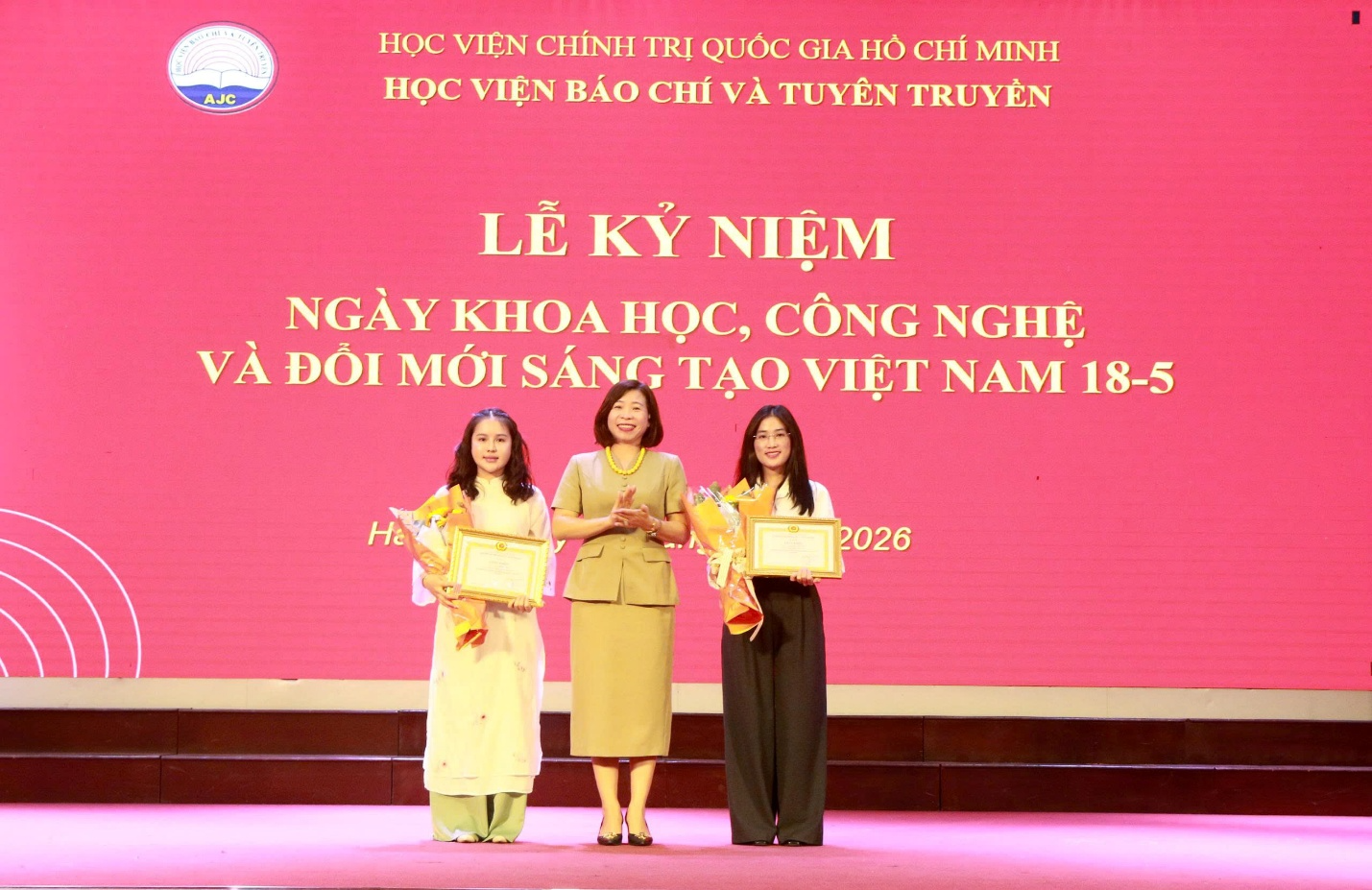 A group of women standing on a stage Description automatically generated
