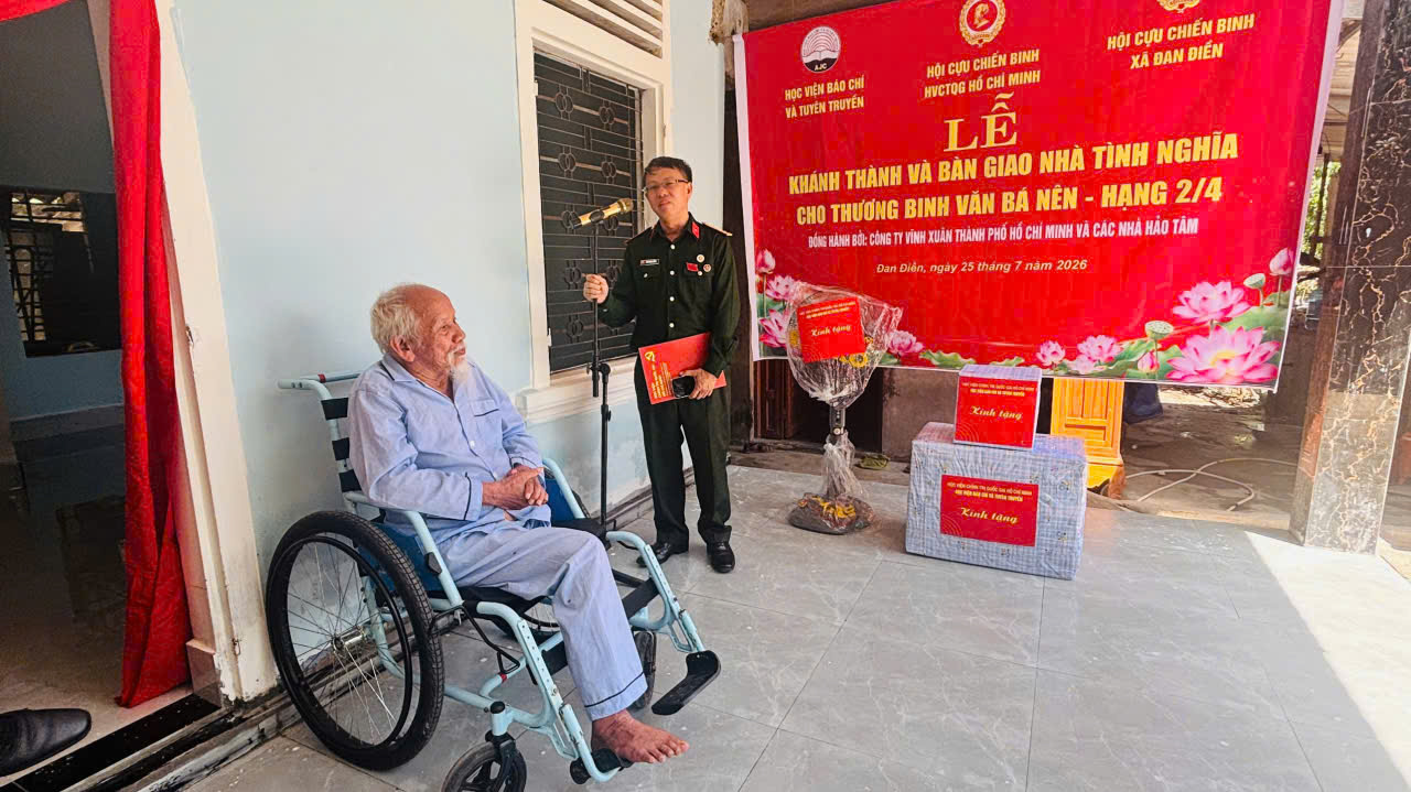 A person in a wheelchair and a person in a uniform Description automatically generated